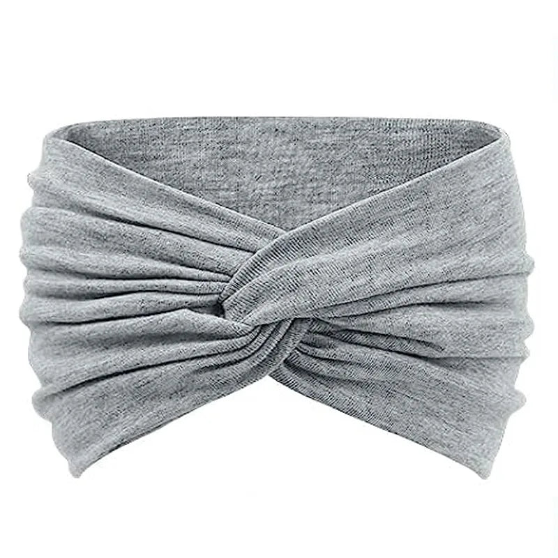 Gray knitted yoga headband with a twisted knot design