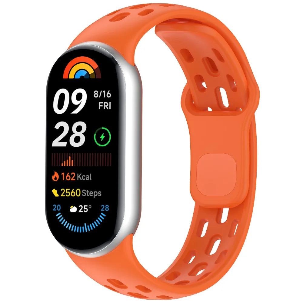 An orange silicone smart watch band replacement with a black digital display showing fitness metrics.