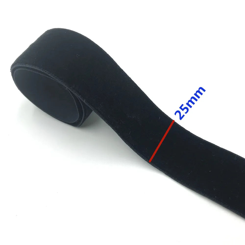 Black stretch velvet elastic headband shown diagonally with a 25mm measurement mark.