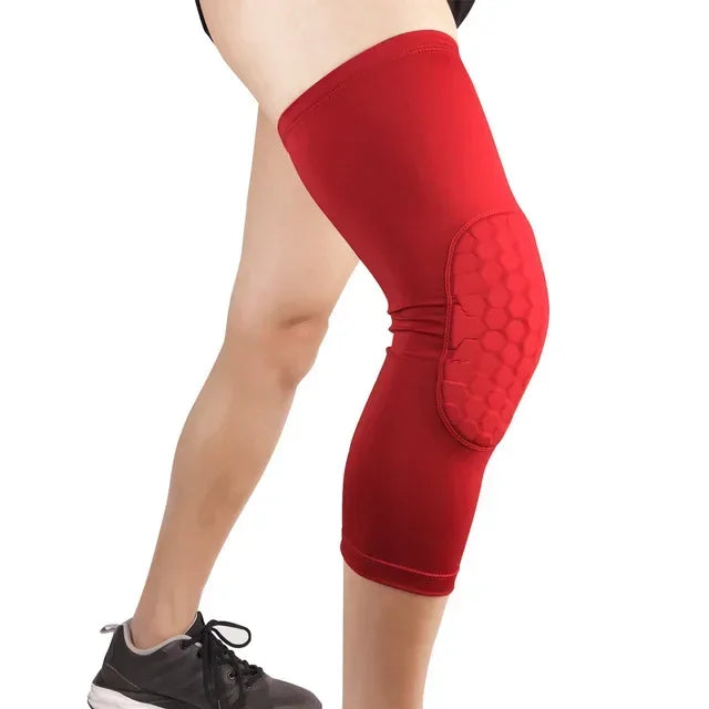 A person wearing red compression knee pads for sports and gym.