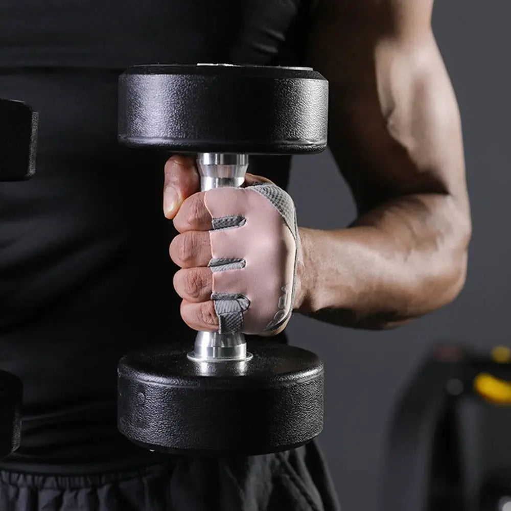 A person is holding a black dumbbell with silver plates using ergonomic anti-slip gym lifting gloves.