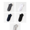 A collection of ankle socks in various colors including gray, white, navy blue, black, and silver.
