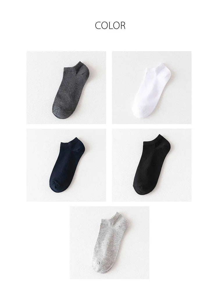 A collection of ankle socks in various colors including gray, white, navy blue, black, and silver.