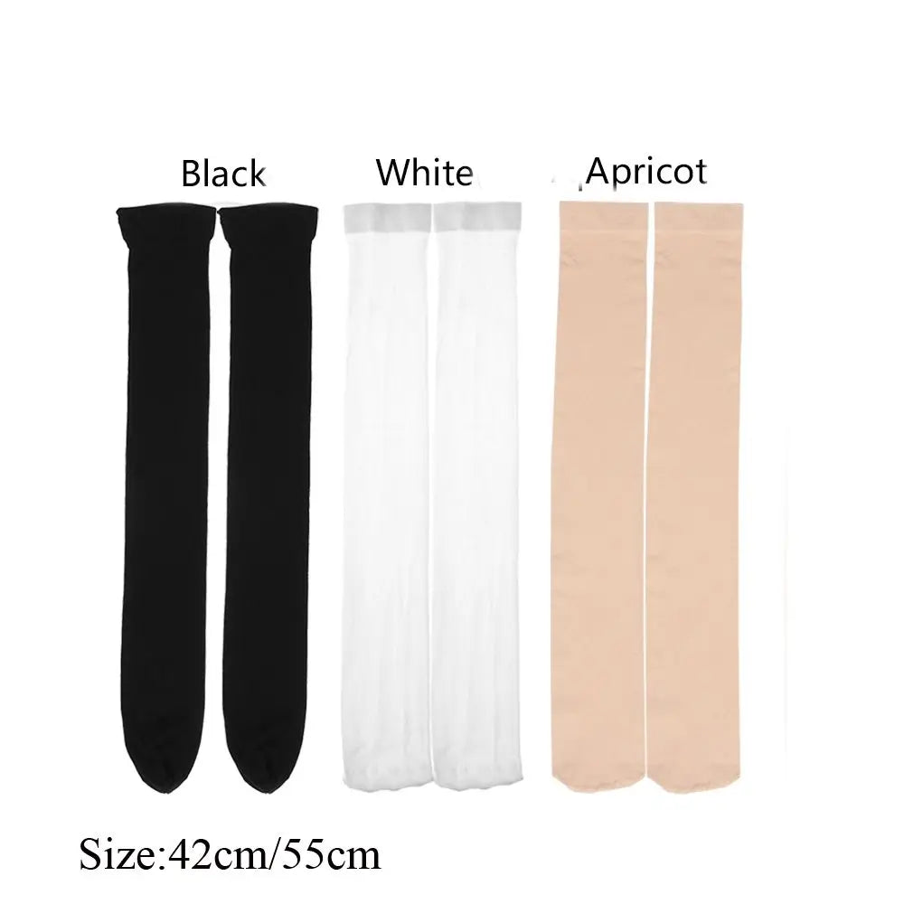 Three pairs of thigh high elastic socks in black, white, and apricot colors shown side by side.