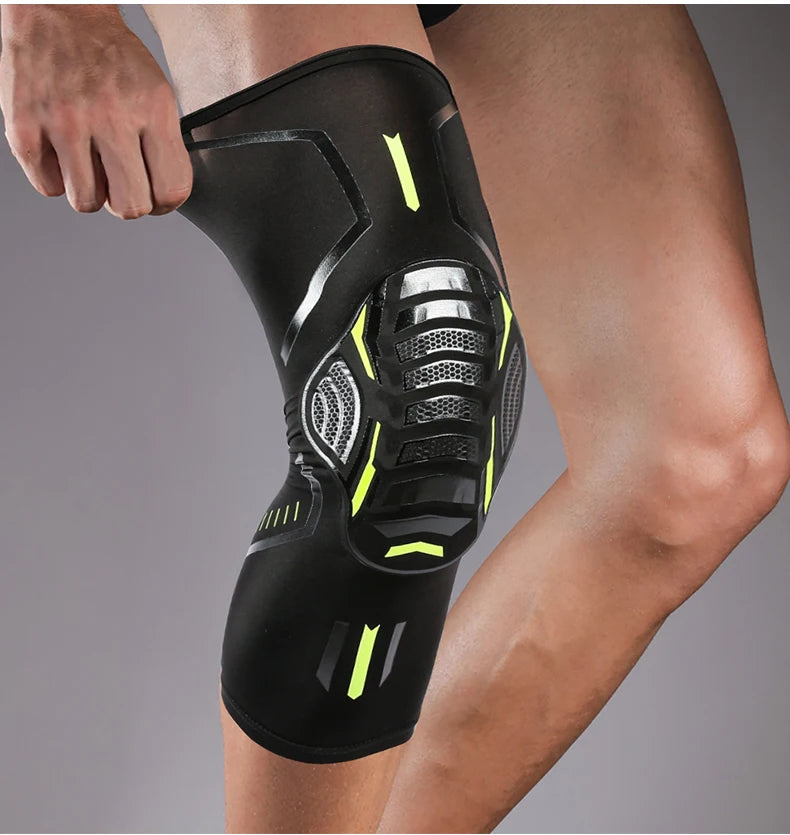 A black performance knee compression sleeve worn on a person's leg.