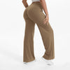 A person is modeling tan NCLAGEN SoftMotion Straight Leg Yoga Pants in a neutral tone.