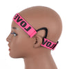 A mannequin head shows an adjustable lace wig band in bright pink spelling out LOVE across the hairline.