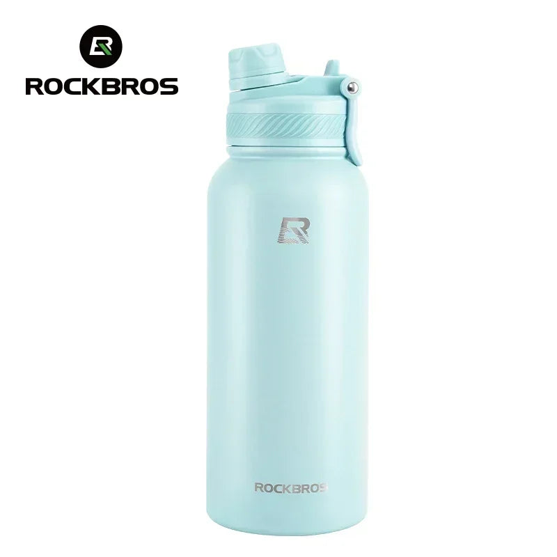 A light blue insulated stainless steel thermal water bottle with a clear cap and black logo.