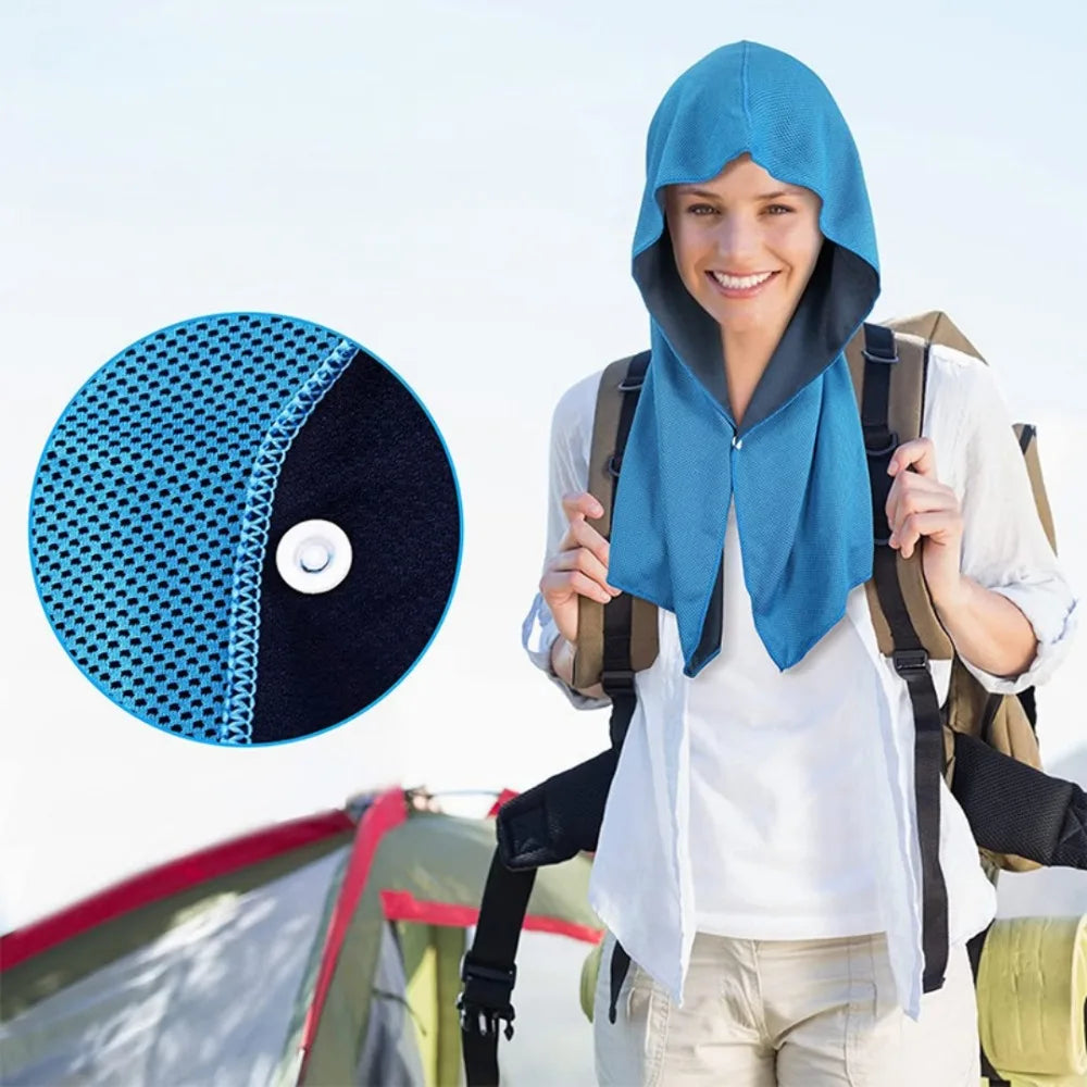 A smiling woman wearing a blue cooling sports headscarf and backpack in an outdoor setting.