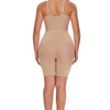 A woman wearing a beige full body shapewear bodysuit for slimming, shown from the back.