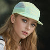 A young woman wearing a light green breathable quick-dry baseball cap with text on the front.