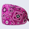 A vibrant magenta printed cotton surgical cap featuring intricate black and white floral patterns.