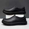 A pair of black men's anti-slip oil-resistant kitchen clogs shown from the side.