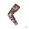 A close-up of a black and gray reusable stretch tattoo arm sleeve worn on an arm.