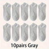 Ten pairs of gray comfort fit ankle socks laid out in a row.