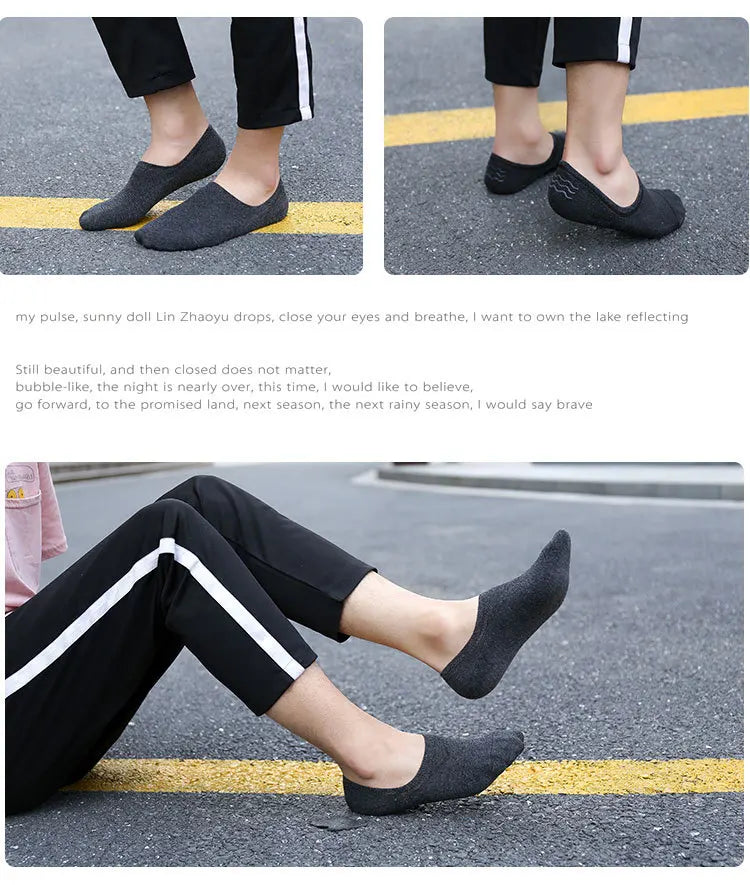 A person wearing black breathable boat socks walking on asphalt with yellow lines.