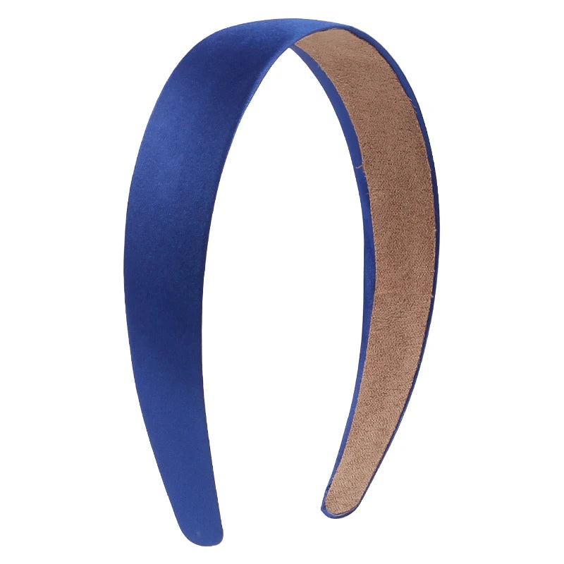 A pair of solid satin hair bands, one blue and one brown, shown in a curved shape.