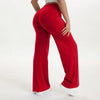 A person is modeling red NCLAGEN SoftMotion Straight Leg Yoga Pants from the side.