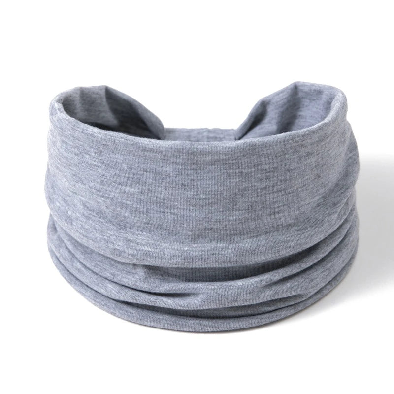 A gray boho wide headband hair wrap for women shown flat.