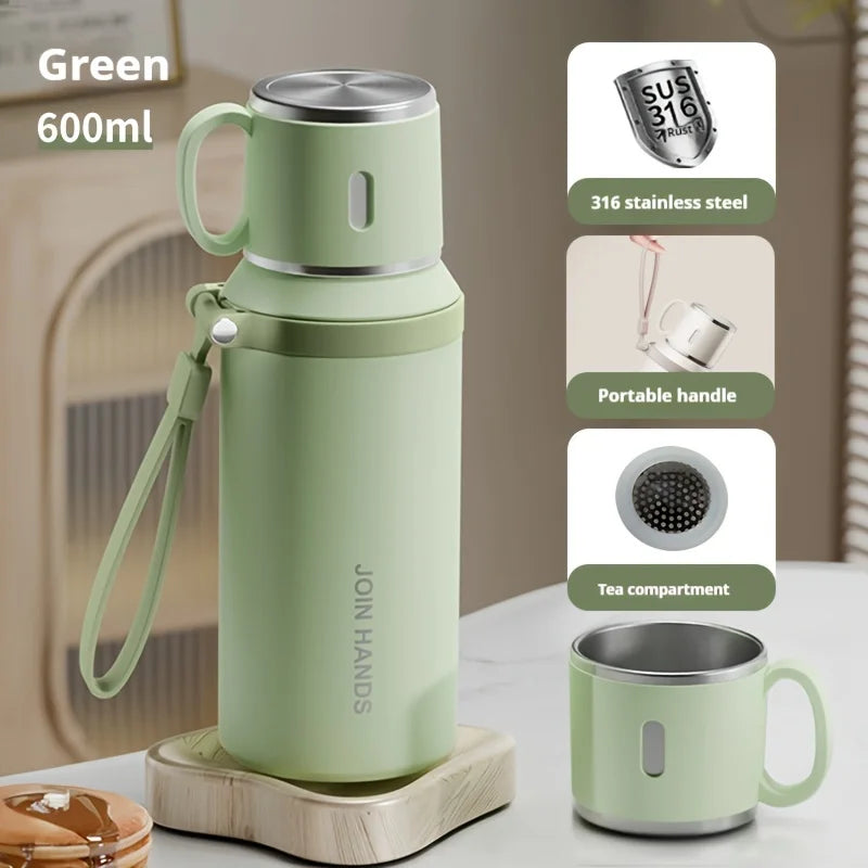 A light green 600ml stainless steel insulated water bottle with a portable handle and tea compartment.