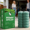 A box of rodent repellent balls is displayed on a concrete floor in a garage setting.