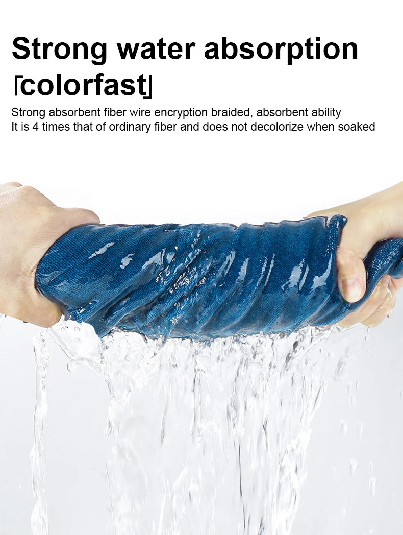 A hand is holding a blue absorbent fiber cleaning towel while water flows over it.