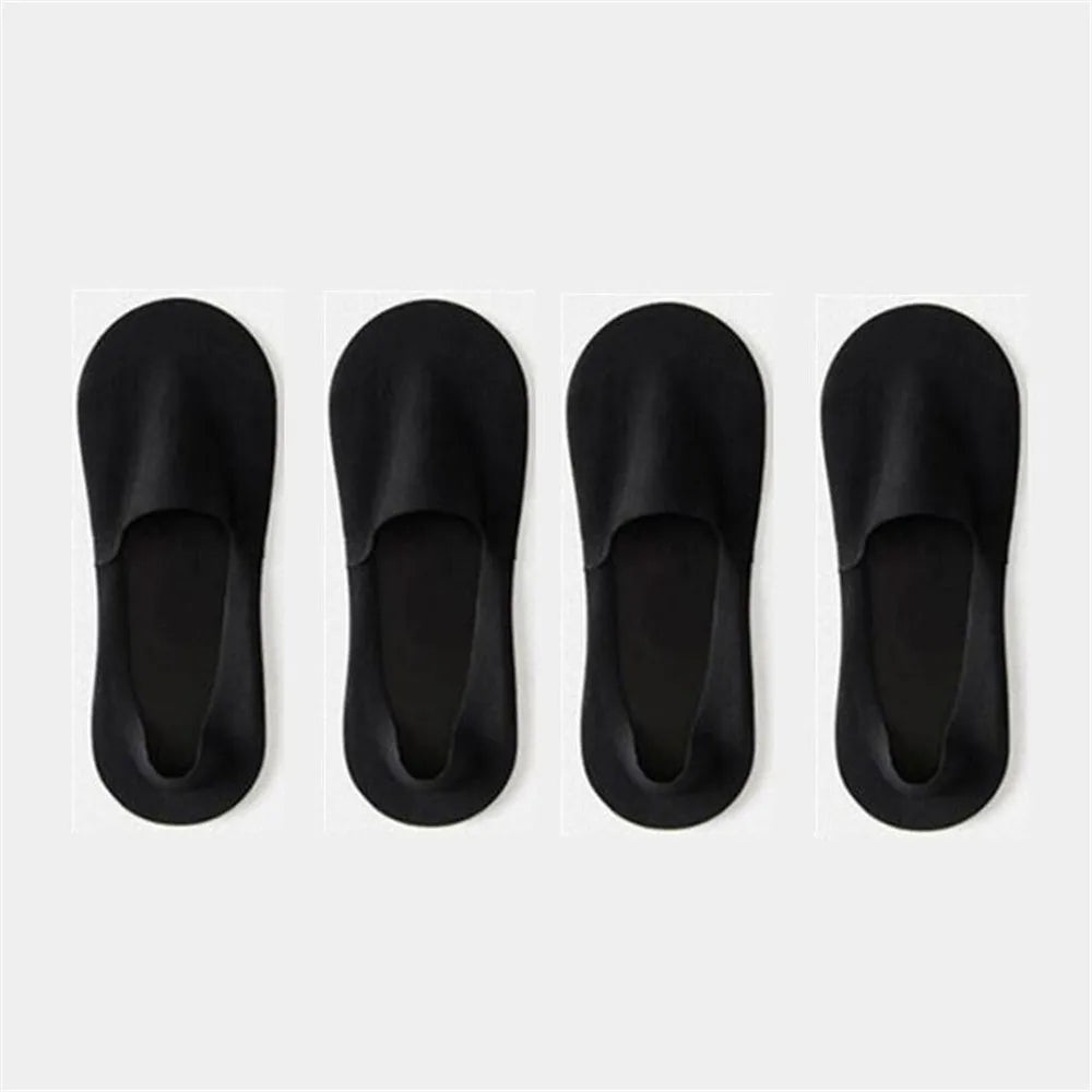 Four pairs of black men's invisible boat socks shown from the top view.