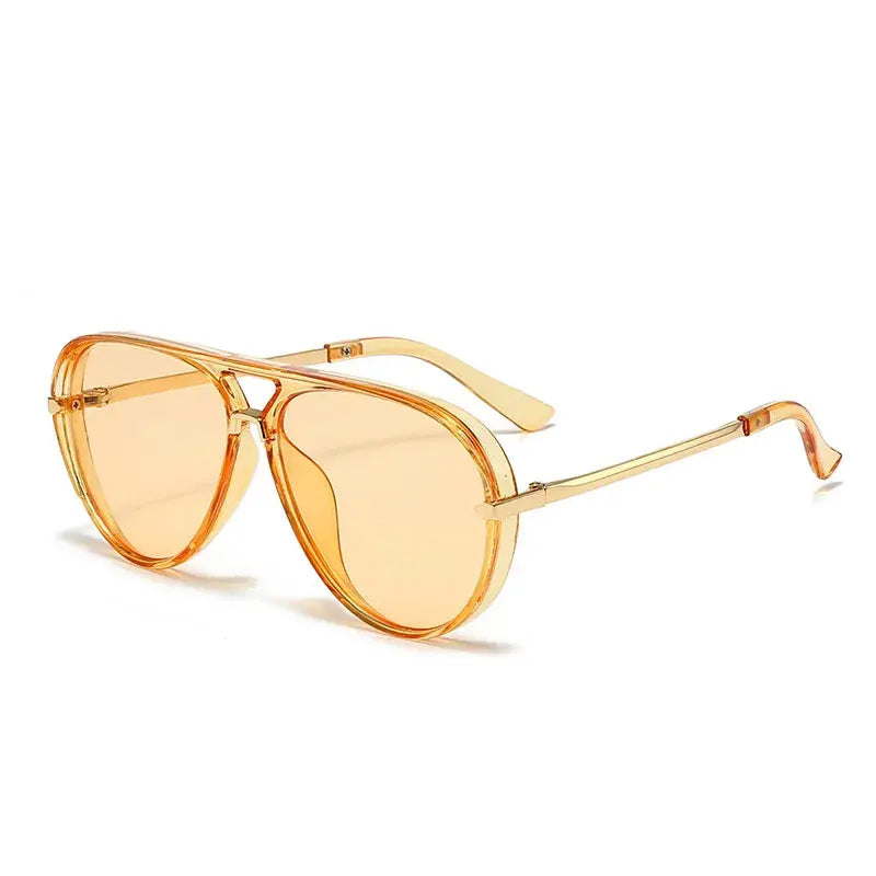 A pair of classic oval pilot sunglasses with gold-toned frames and yellow lenses.