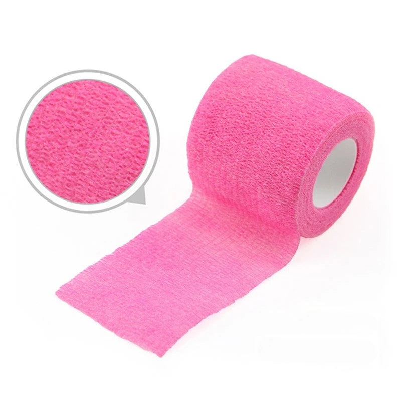 Pink self-adhesive elastic bandage tape rolled and unrolled, showing the texture of the material.