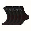 A row of black men's high-cut breathable casual crew socks with white crosses on the toe.