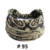 Black and gold boho print cotton headbands rolled into a thick, textured band.