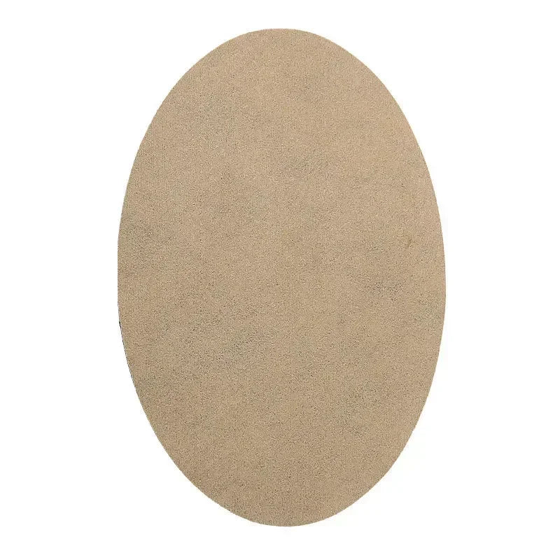A round, beige anti-wear thigh patch for friction relief.
