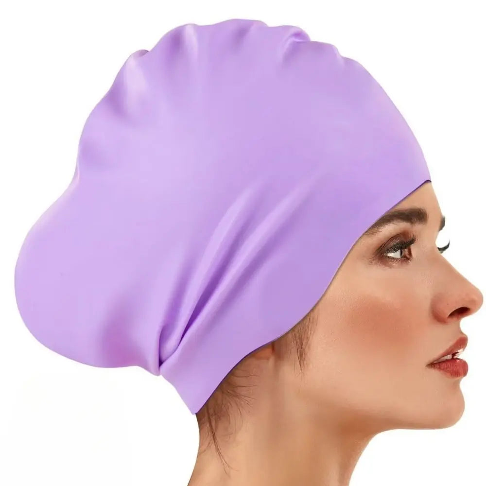 A purple silicone swim cap is shown on a model's head, highlighting its smooth texture and fit.