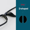 A pair of black D-shaped silicone anti-slip eyeglass nose pads shown next to product details.
