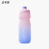 A pink and blue squeezable cycling water bottle against a white background.