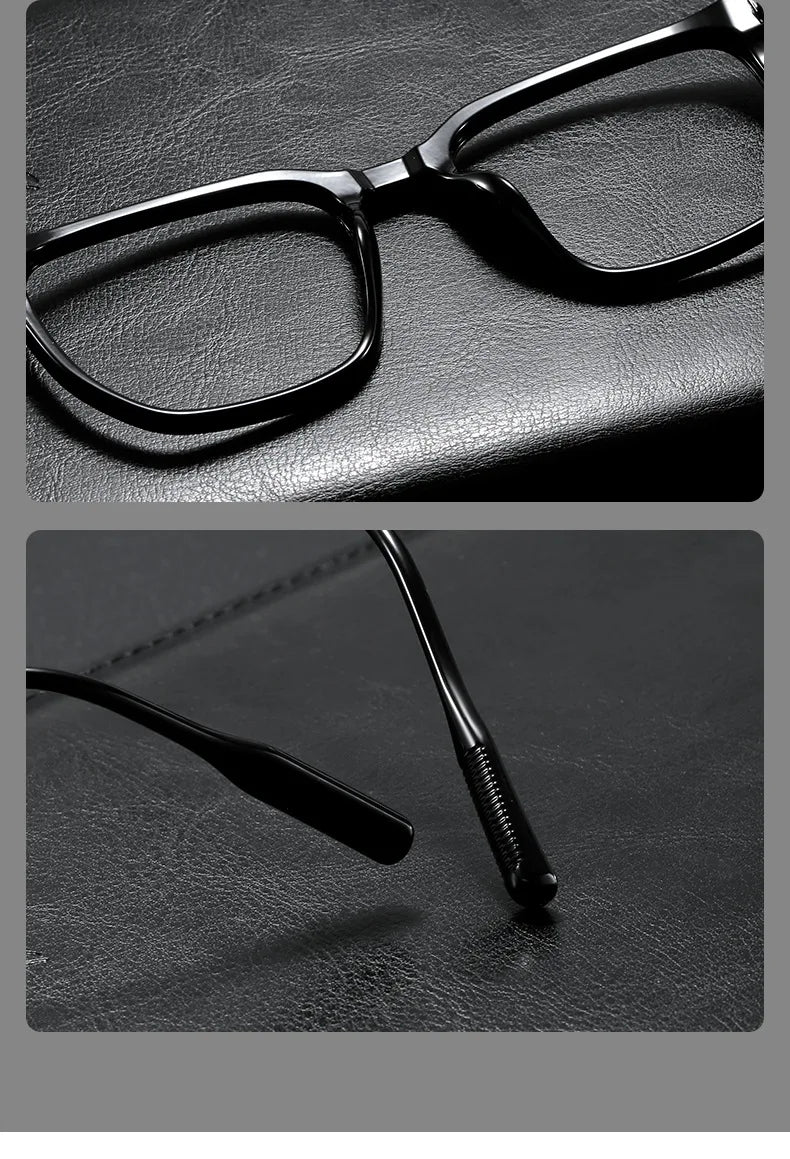 A close-up of retro black anti-blue light glasses resting on a dark surface.