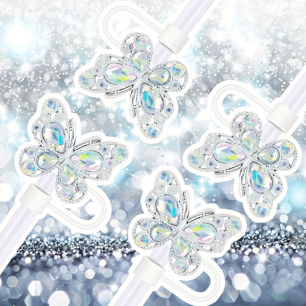 Un set de quatre embouts à paille en silicone en forme de papillon avec des accents de paillettes irisées