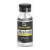 A glass bottle of Walker Tape Ultra Hold hair system adhesive for hair replacement