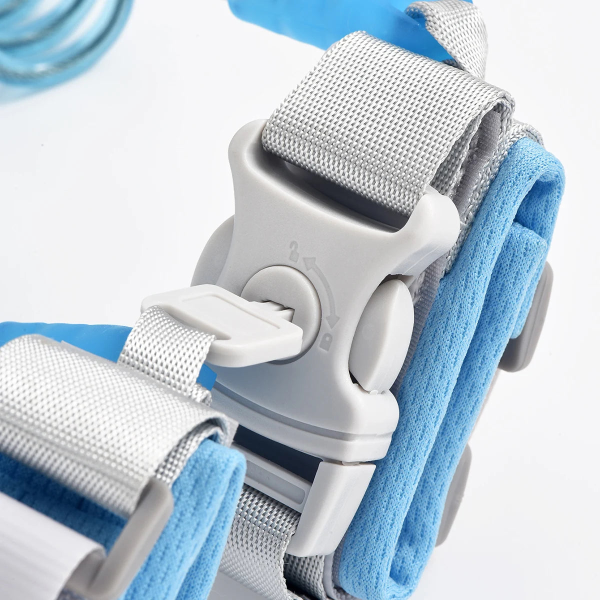 A close-up view of a gray and blue adjustable child safety harness and leash for toddlers.