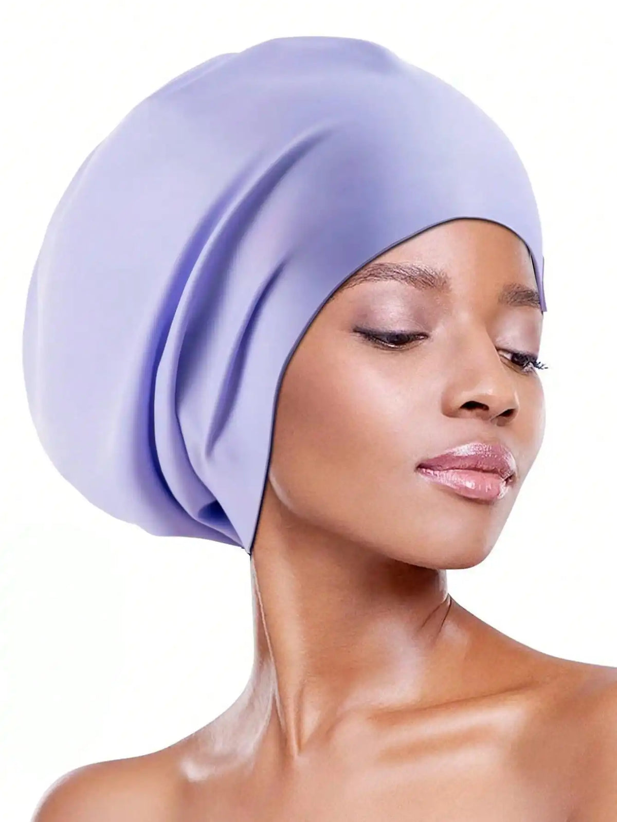 A model wearing a lavender silicone swim cap for long hair against a white background.