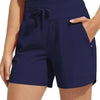 Navy blue high-waisted quick-dry athletic shorts worn by a woman.