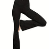 Black high-waist crossover flare leggings worn by a person.