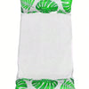 A white inflatable pool float hammock with green tropical leaf pattern.