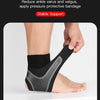 A hand is applying a black compression ankle brace to a person's foot and ankle for support.