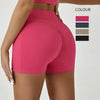 A model wearing bright pink high-waisted yoga and fitness leggings with a color palette selection.