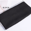 A black knitted headband measuring 19cm long and 9cm wide.