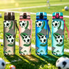 Four colorful water bottles featuring a green football pattern are displayed outdoors on a grassy field.