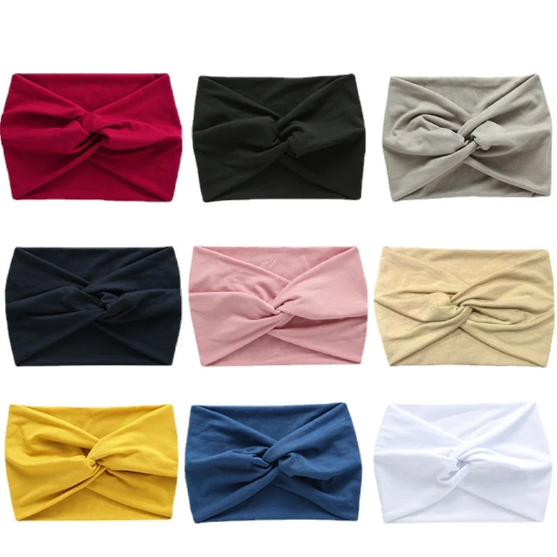 A collection of women's elastic sports headbands in various colors including red, black, beige, pink, and yellow.