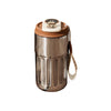 A stainless steel insulated thermos bottle with a white display lid and a brown leather strap.
