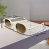 A pair of vintage oval sunglasses with light beige frames and tinted lenses displayed on a white surface.